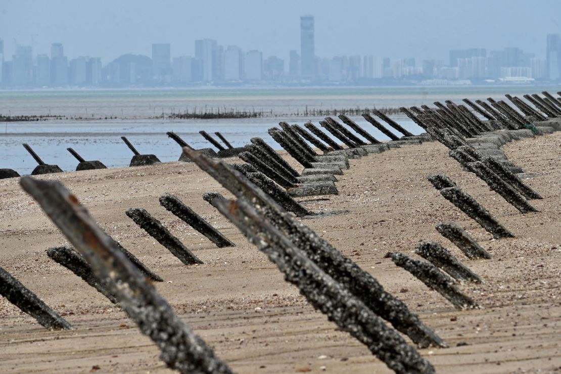 This photo taken on October 20, 2020 shows anti-landing spikes placed along the coast of Taiwan's Kinmen islands, which lie just 3.2 kms (two miles) from the mainland China coast (in background) in the Taiwan Strait. - The tank traps on the beaches of Kinmen Island are a stark reminder that Taiwan lives under the constant threat of a Chinese invasion -- and fears of a conflict breaking out are now at their highest in decades. (Photo by Sam Yeh / AFP) / TO GO WITH Taiwan-China-US-politics-military-Kinmen,FOCUS by Amber WANG and Jerome TAYLOR (Photo by SAM YEH/AFP via Getty Images)